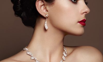 lady in photoshoot wearing earrings and necklace