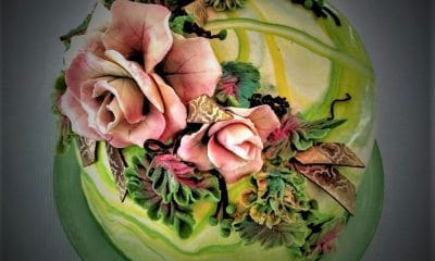 John Buzogany cake decorated with flowers