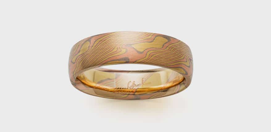 hris Ploof Designs 18K yellow gold ring with 14K red gold and 14K palladium white gold. 