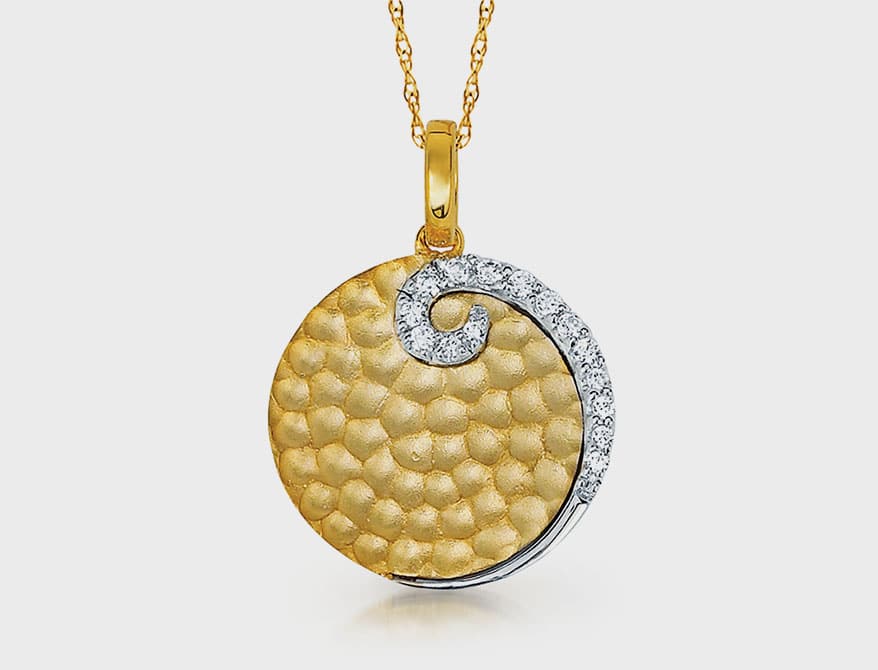 Ostbye 14K yellow gold pendant with diamonds.