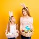 girl and woman holding easter baskets