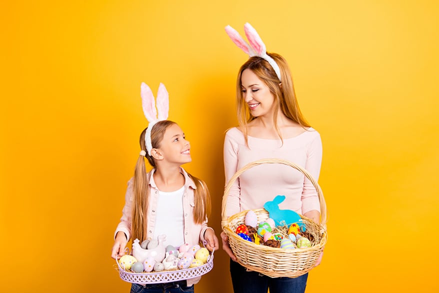girl and woman holding easter baskets