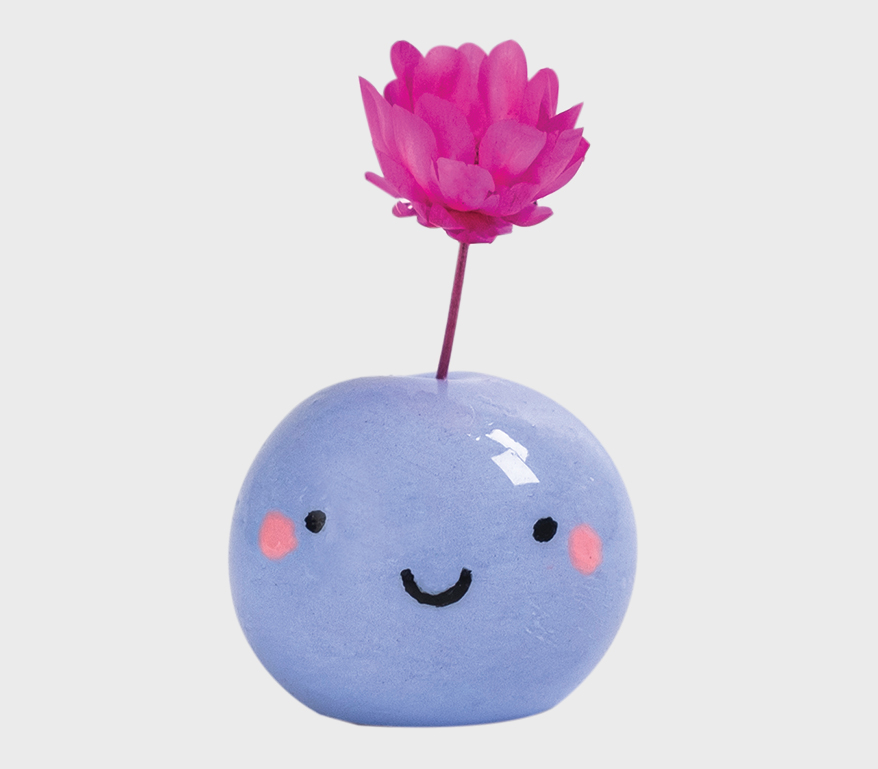 minuscule smiling face and a dainty dried flower.