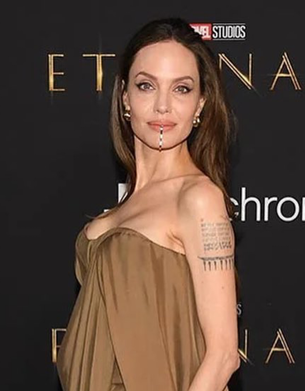 Angelina Jolie Raises Eyebrows with Custom Face Jewelry Judge the Jewels