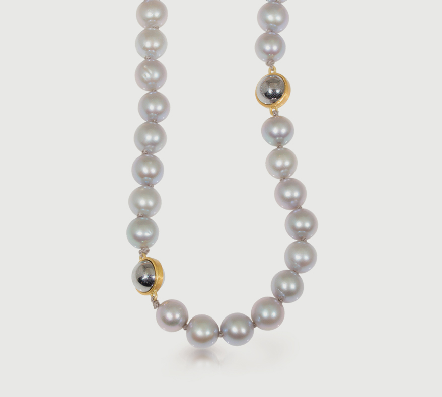 Freshwater pearl necklace on silk with 18K and 22K yellow gold and ball bearings.