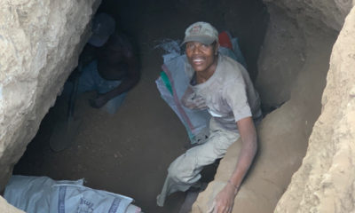 An artisanal gem miner gazes up from the entrance to a tanzanite mine in Merelani.