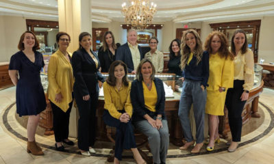 Even though this virtual silent auction has concluded, the staff of Roman Jewelers continues to raise awareness by inspiring others. Co-owner, Lucy Zimmerman (seated, left), is set to design a new pendant to continue fundraising efforts.