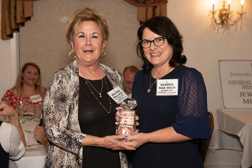 Vice President Dianna Rae High presents Melinda Wallace, manager of Pattons Fine Jewelry, with the Jewelers of Louisiana Award.
