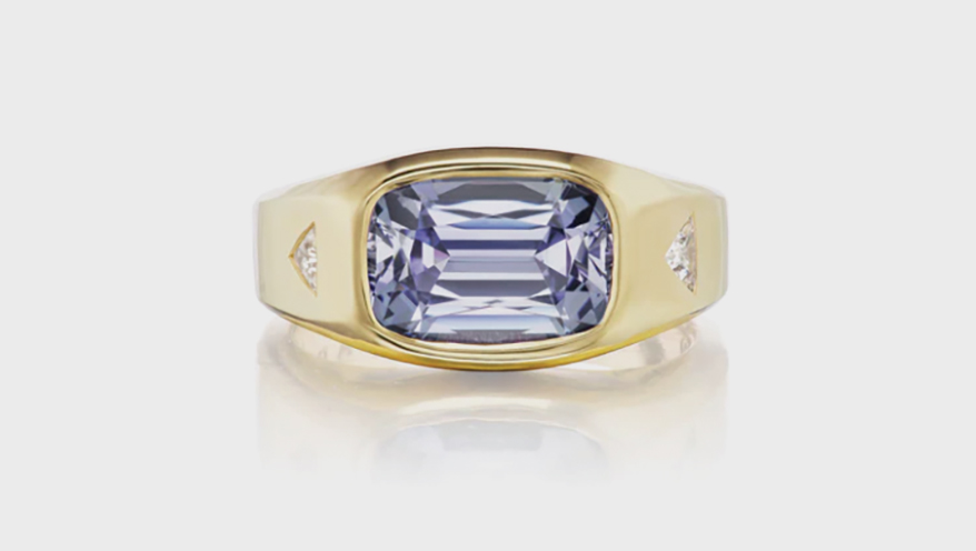 Ark Fine Jewelry Creation  Gypsy-set tanzanite center stone ring with diamond trillions.