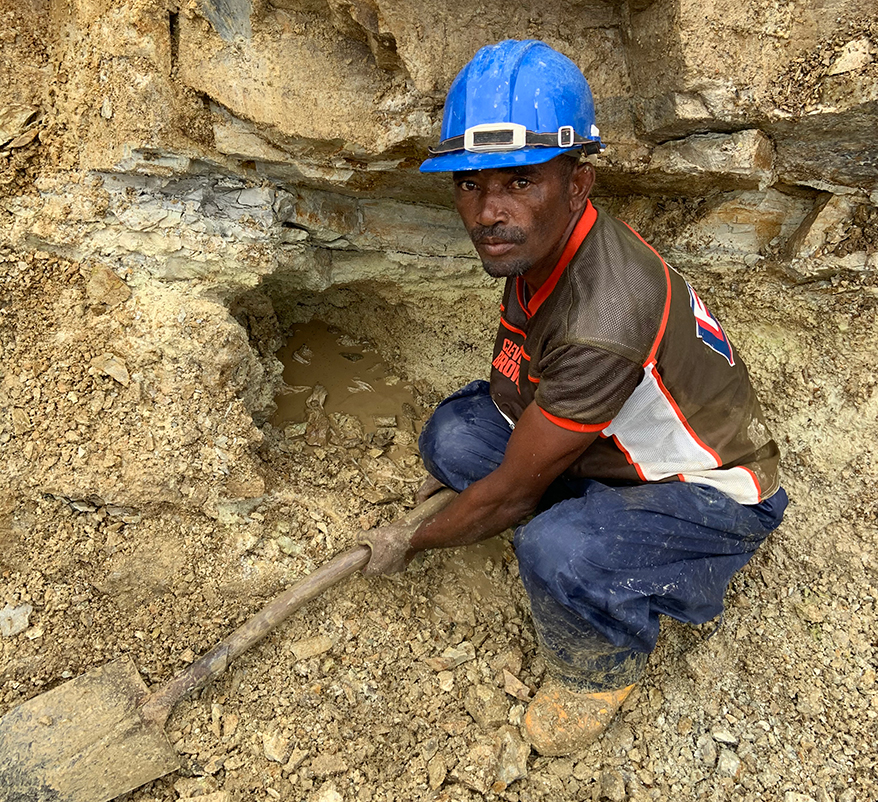 A miner on site at Prosperity Earth’s demantoid mine site in Madagascar