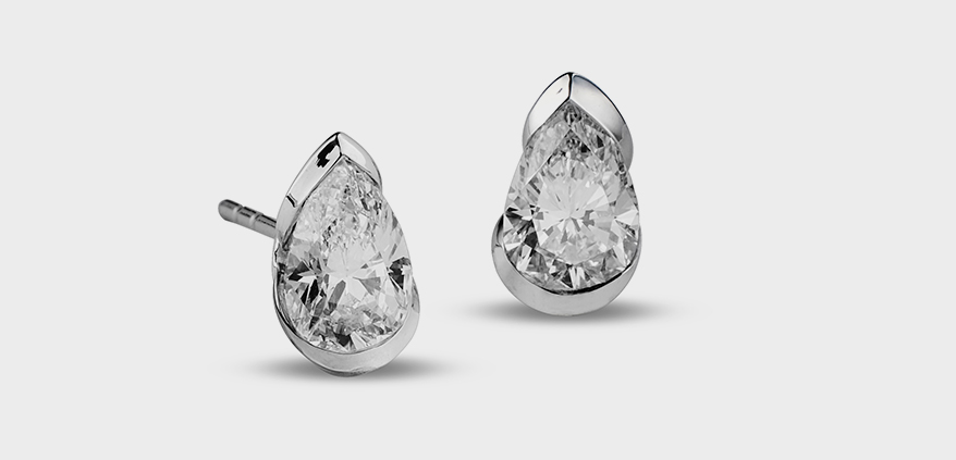 Reza pear shaped diamond studs (only one worn)