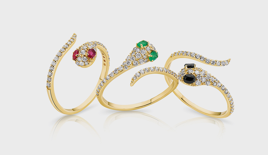 Gold ring with diamonds (0.298 TCW) and emerald, ruby or black onyx.
