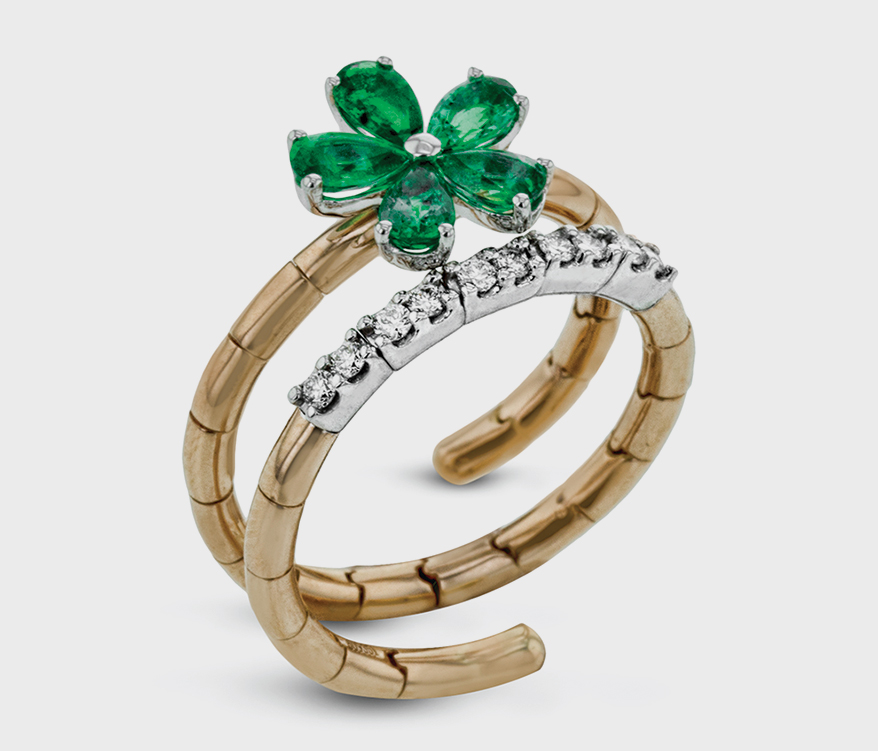 Flower ring in 18K rose gold with diamonds and emeralds from the Simon G.