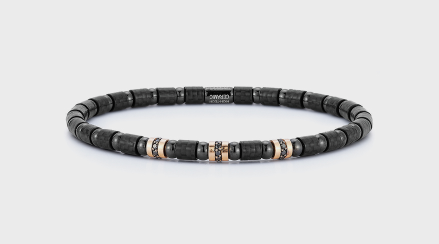 Carbon bracelet with rose gold and black diamonds.