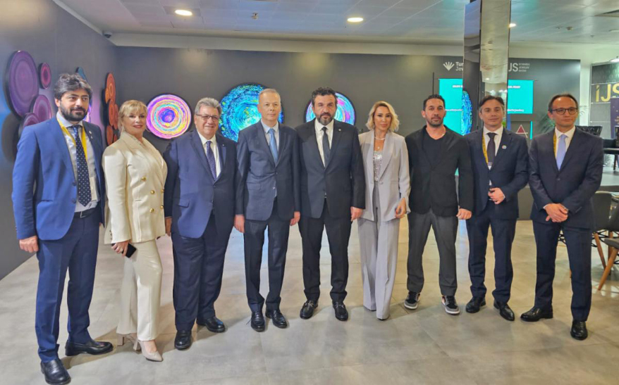 CIBJO President Gaetano Cavalieri (third from left) at the opening of the “Art For Jewellery – Inspiration Hub" at the Istanbul Jewellery Show on August 17, 2024. He is flanked (from left) by Murad Köşker, Turkish Jewellery Exporters Association Board Member; Aylin Gozen, Turkish Jewellery Exporters Association Consultant and Hub of Culture Project Partner; Ö. Volkan Ağar Deputy Minister of Trade of the Republic of Türkiye; Burak Yakin, Turkish Jewellery Exporters Association President; Oznur Yakin, Hub of Culture Project Partner; Emre Namyeter, an artist; Atilla Marangozoğlu, Informa Markets General Manager; and Tuğber Yasa, Informa Markets Exhibition Director.