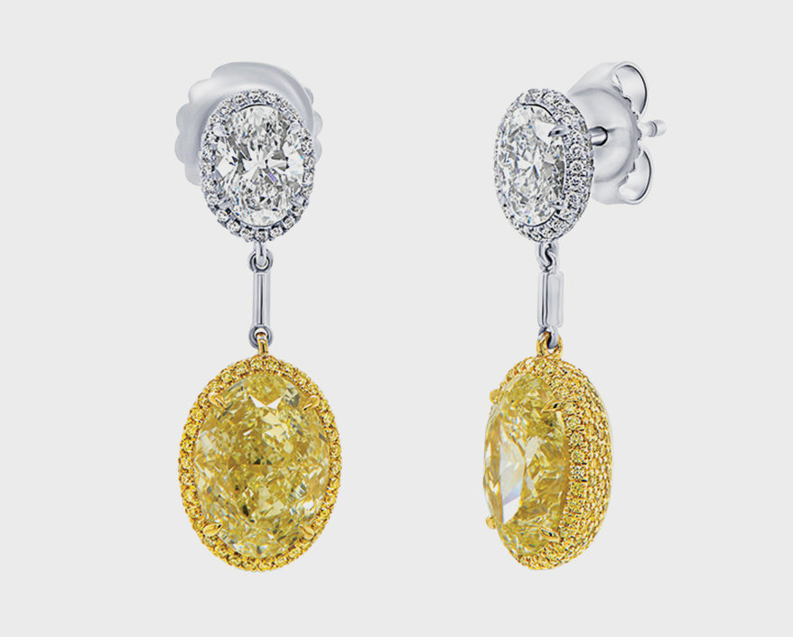 Uneek Jewelry 18K white gold earrings with diamonds and colored diamonds.