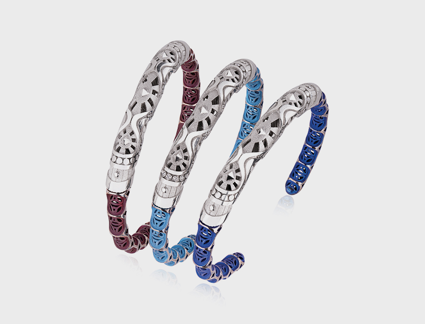 Three-part cuff bracelet in platinum and anodized titanium.